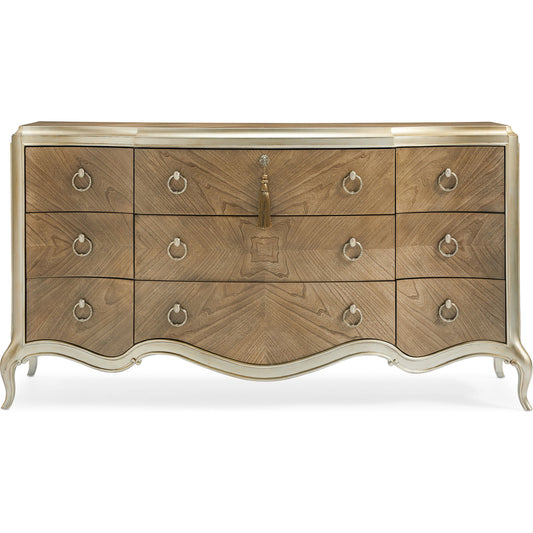 Triple Dresser by Caracole in champagne mist and cendre, champagne mist. Made from asian hardwood, bleached flat cut walnut in a transitional style.