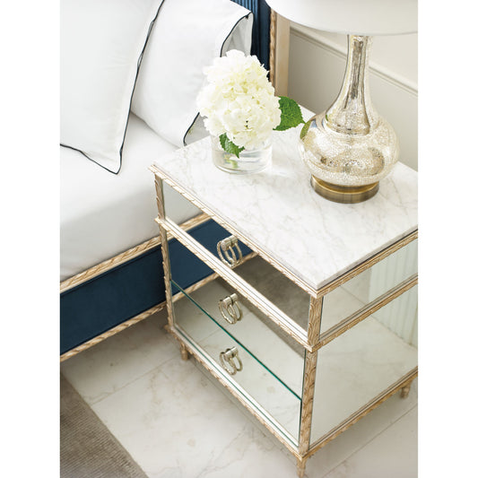 Rococo Nightstand by Caracole in aglow and aglow. Made from asian hardwood, aluminum, resin in a transitional style.