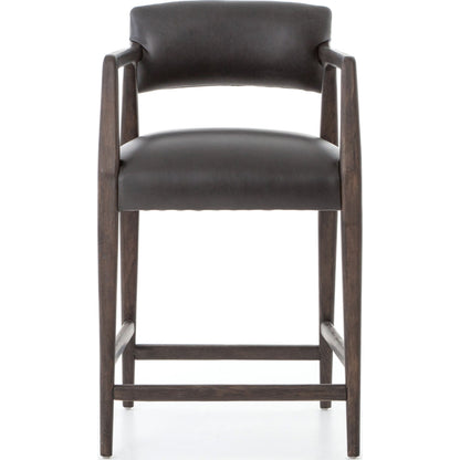 Tyler Counter Stool by Four Hands in chaps ebony, burnt oak. Made from top grain leather, solid nettlewood, 100% polyester in a modern style.