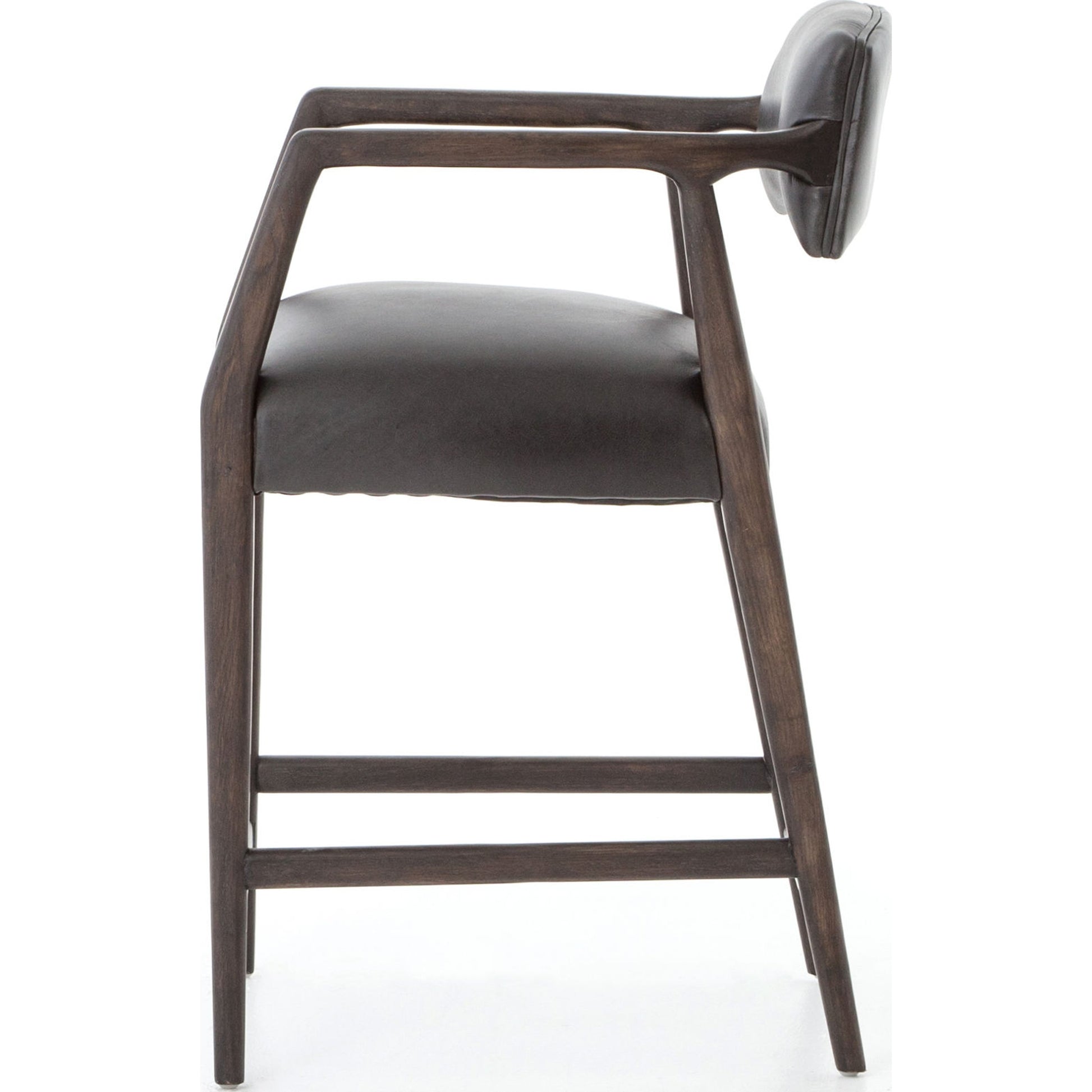 Tyler Counter Stool by Four Hands in chaps ebony, burnt oak. Made from top grain leather, solid nettlewood, 100% polyester in a modern style.