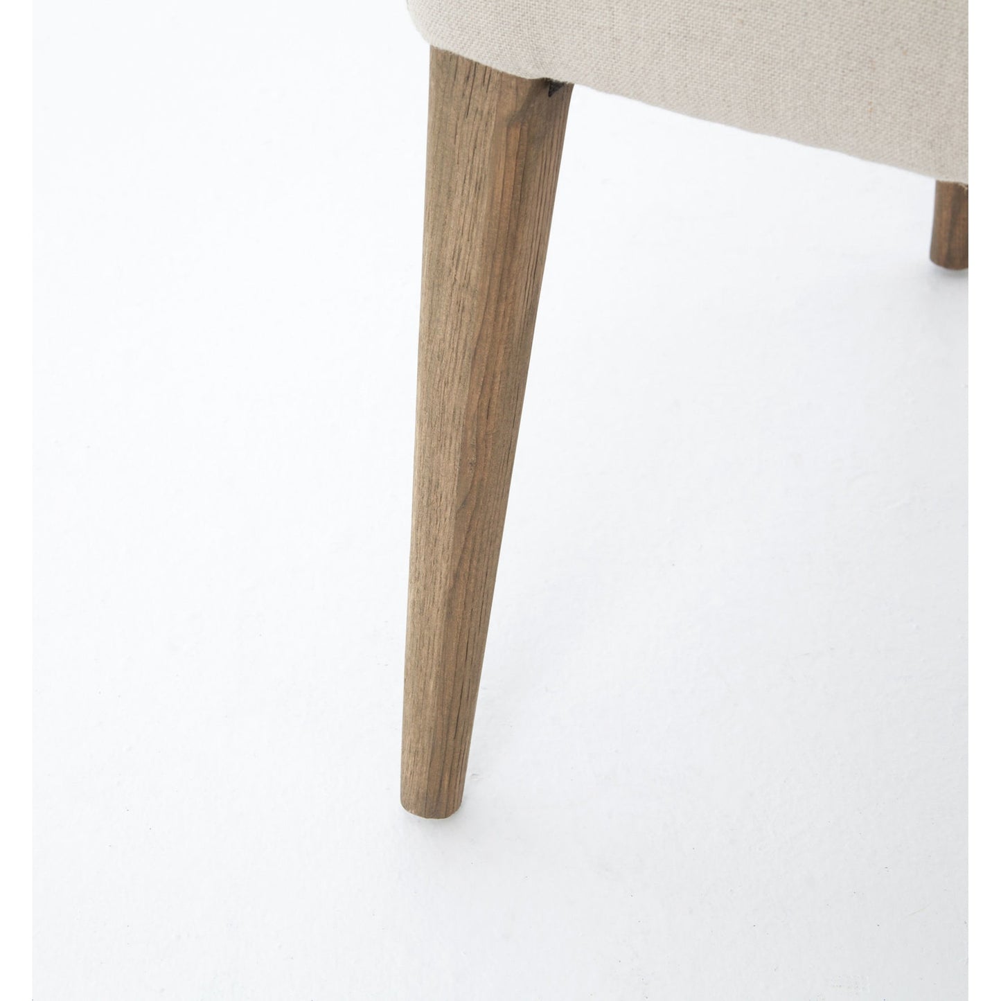 004 S-258339 | Closeup | Kurt Dining Chair by Four Hands in dark linen, dark oak and dark linen, dark nettlewood, shoe nail. Made from 100% flax, linen, solid nettlewood, iron in a cottage & farmhouse style.