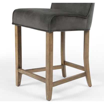 Aria Counter Stool by Four Hands in sienna chestnut. Made from top grain leather, solid nettlewood, 100% polyester in a modern style.