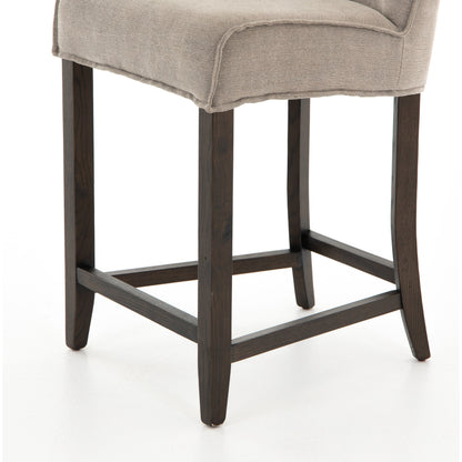 Aria Counter Stool by Four Hands in sienna chestnut. Made from top grain leather, solid nettlewood, 100% polyester in a modern style.