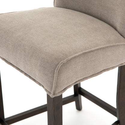 Aria Counter Stool by Four Hands in sienna chestnut. Made from top grain leather, solid nettlewood, 100% polyester in a modern style.