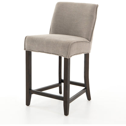 Aria Counter Stool by Four Hands in sienna chestnut. Made from top grain leather, solid nettlewood, 100% polyester in a modern style.