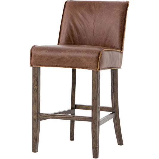 Aria Counter Stool by Four Hands in sienna chestnut. Made from top grain leather, solid nettlewood, 100% polyester in a modern style.