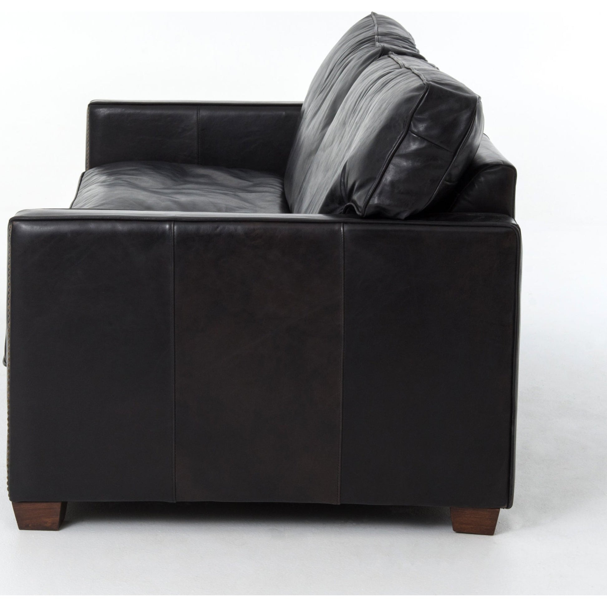 Larkin Sofa by Four Hands in cigar, antique oak, antique brass nailhead. Made from top grain leather, solid ash, iron in a modern style.