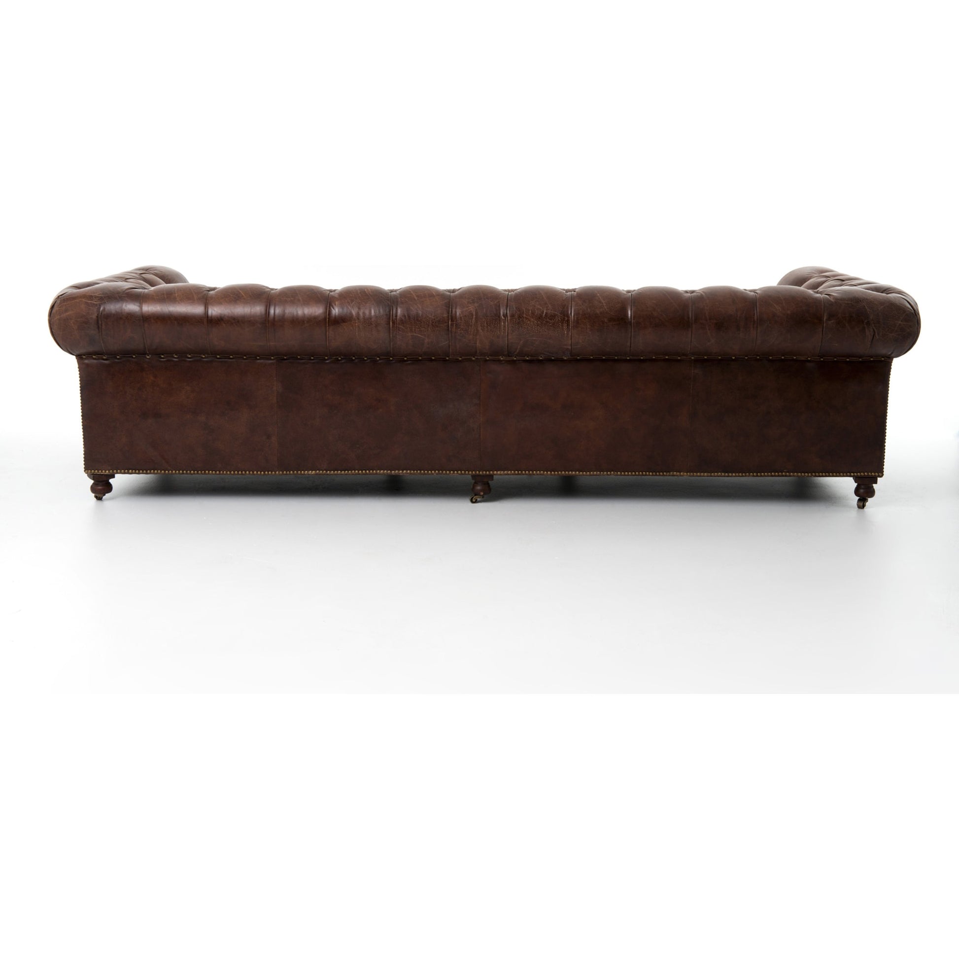 Conrad Sofa by Four Hands in cigar, antique oak, antique brass nailhead. Made from top grain leather, solid ash, iron in a traditional style.