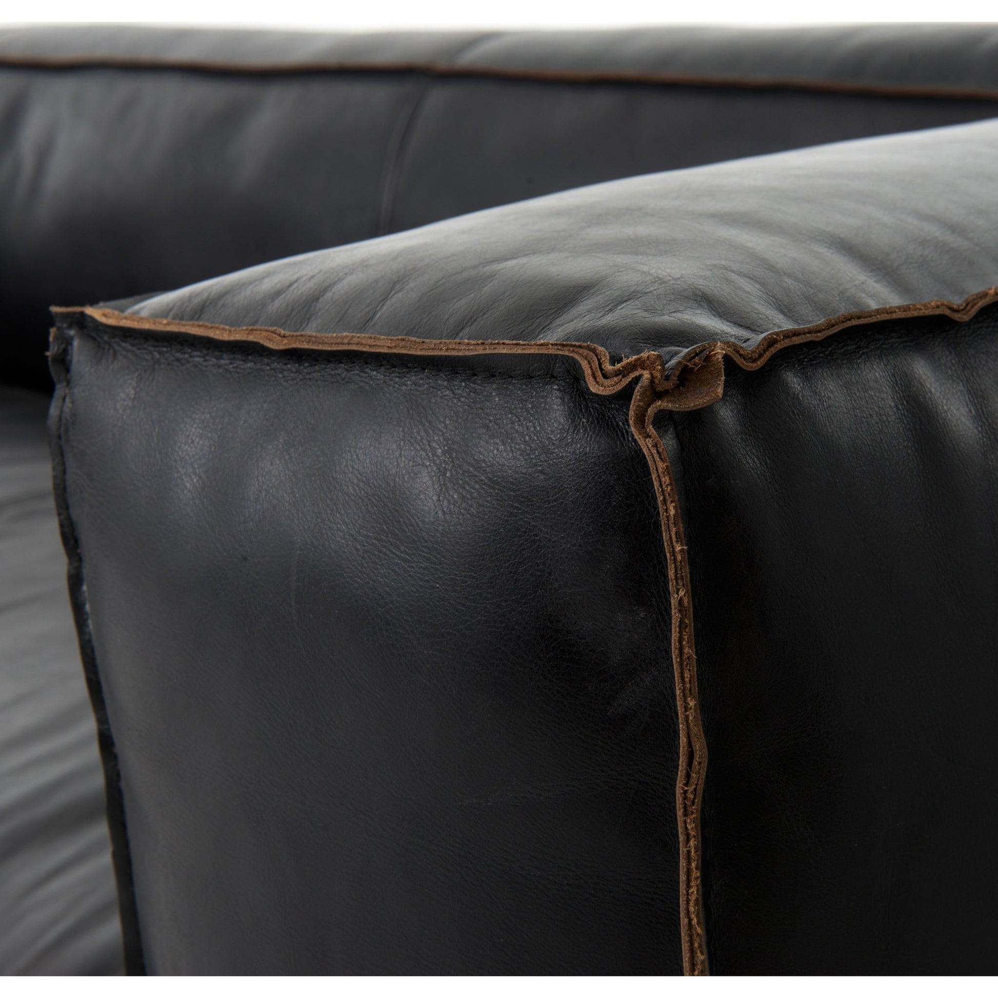 Nolita Reverse Stitch Sofa by Four Hands in rider black. Made from top grain leather, solid ash, 100% polyester in a modern style.