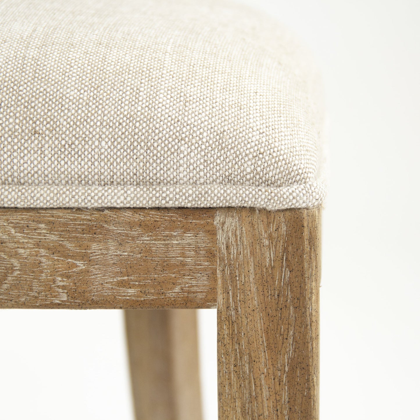 005 S-336856 | Closeup | Carvell Cane Back Side Chair by Zentique in natural cream linen and limed gray oak. Made from limed grey oak in a transitional style.