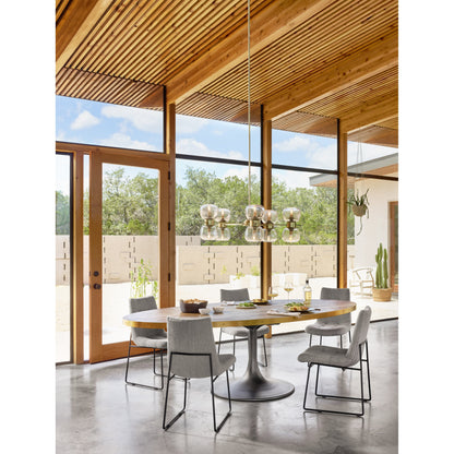 Evans Oval Dining Table by Four Hands in reclaimed burnt oak, vessel grey, polished brass. Made from solid reclaimed oak, iron, stainless steel in a modern style.