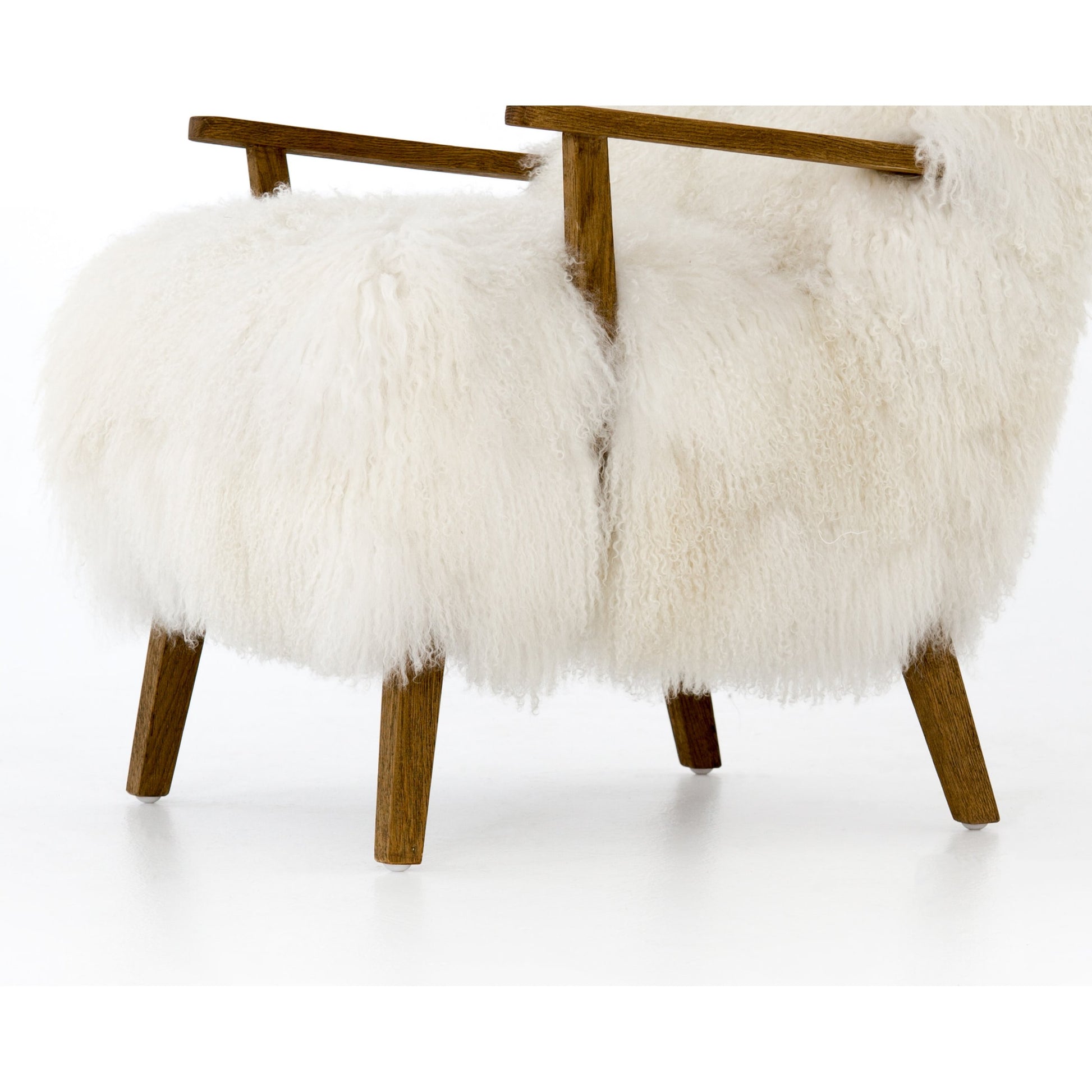 Ashland Armchair by Four Hands in mongolia cream fur, drifted oak. Made from mongolia fur, solid oak, 100% polyester in a modern style.