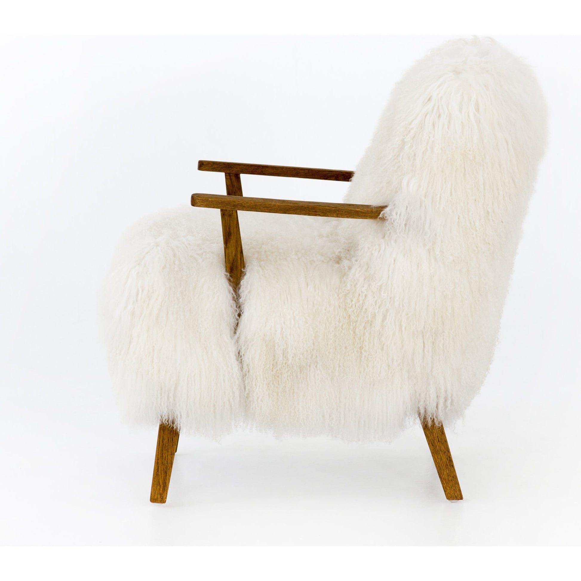 Ashland Armchair by Four Hands in mongolia cream fur, drifted oak. Made from mongolia fur, solid oak, 100% polyester in a modern style.