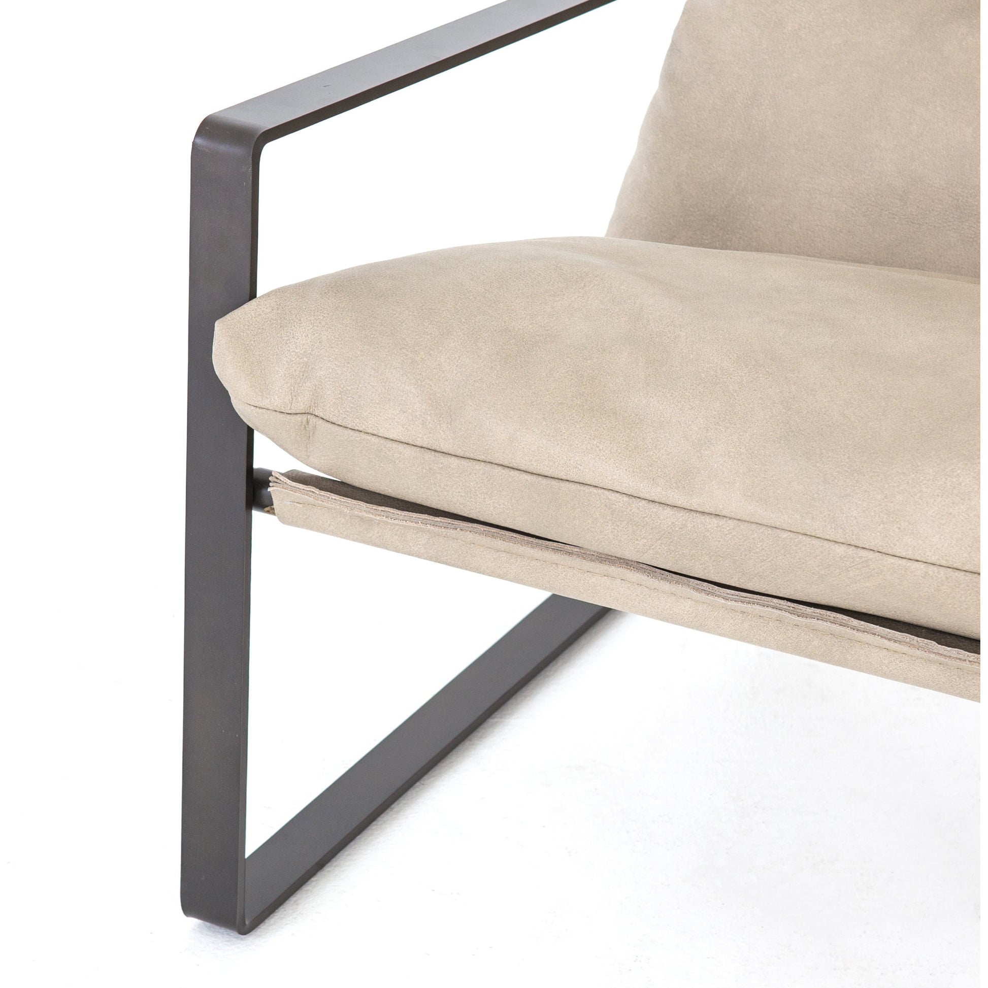Emmett Sling Chair by Four Hands. Made from top grain leather, iron, 100% polyester in a modern style.
