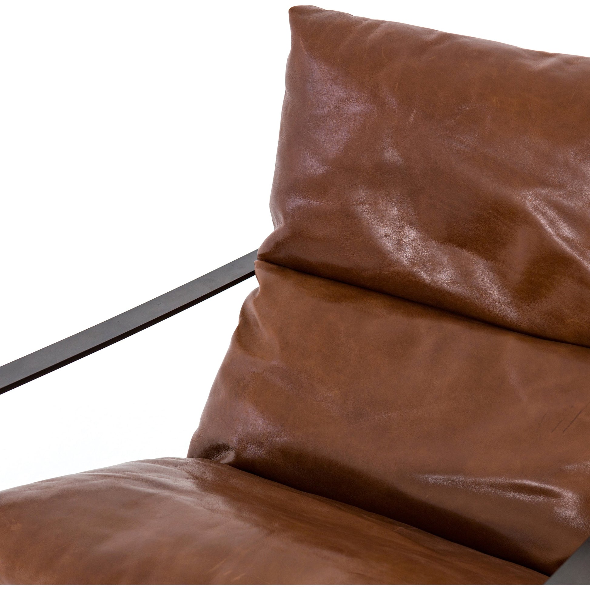 Emmett Sling Chair by Four Hands. Made from top grain leather, iron, 100% polyester in a modern style.