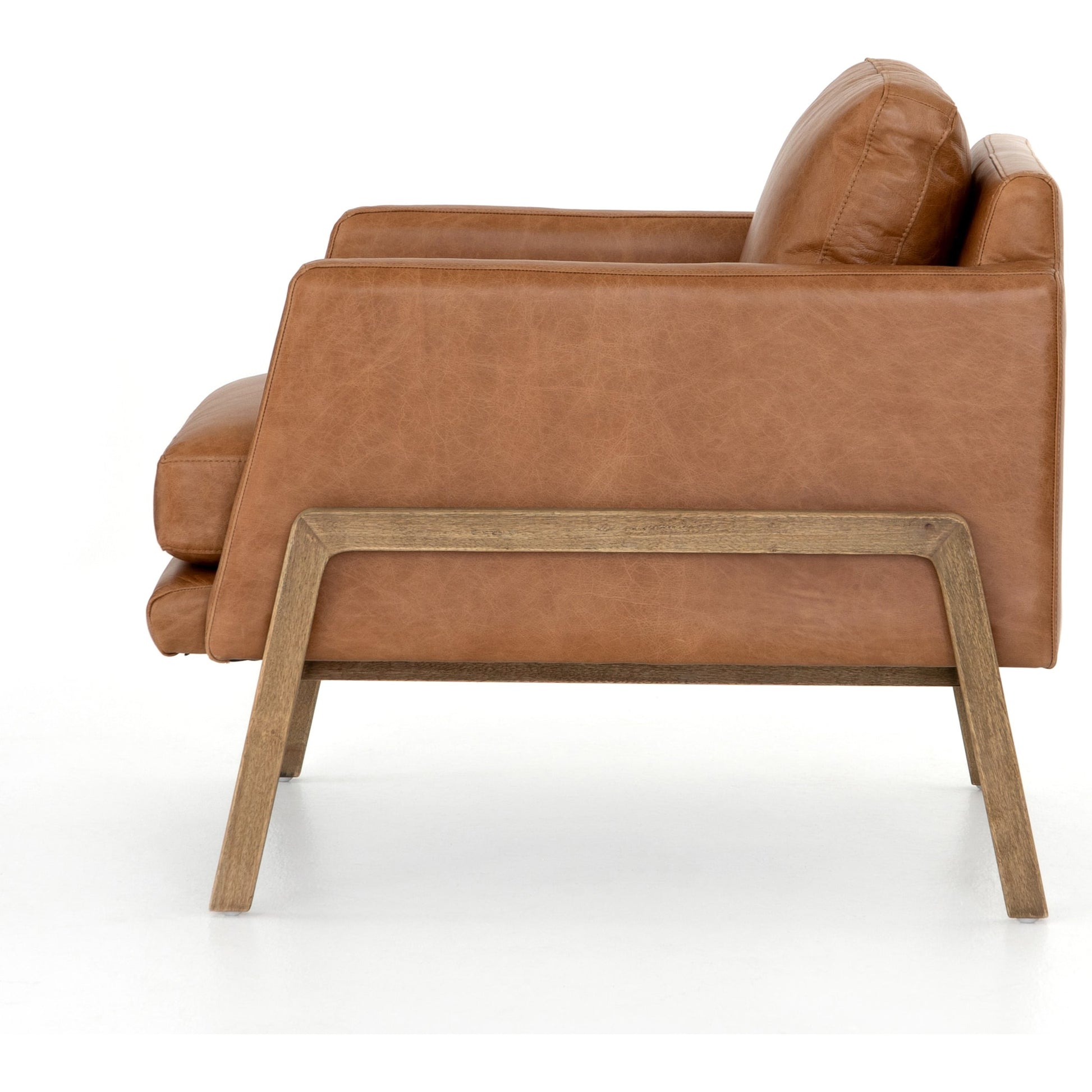 Diana Chair by Four Hands in sonoma butterscotch. Made from top grain leather, solid parawood, 100% polyester in a modern style.