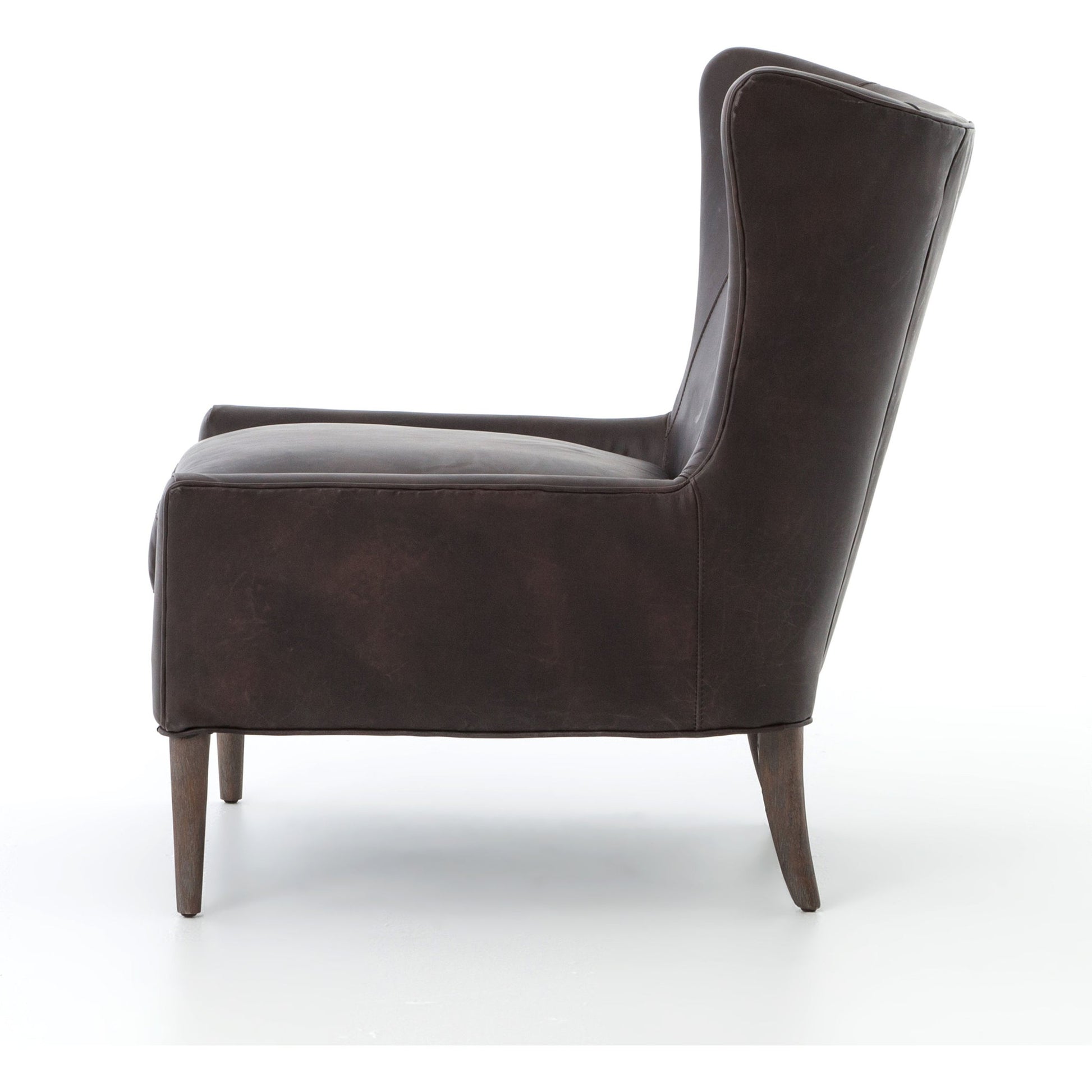 Marlow Wing Chair by Four Hands. Made from top grain leather, solid parawood, 100% polyester in a modern style.