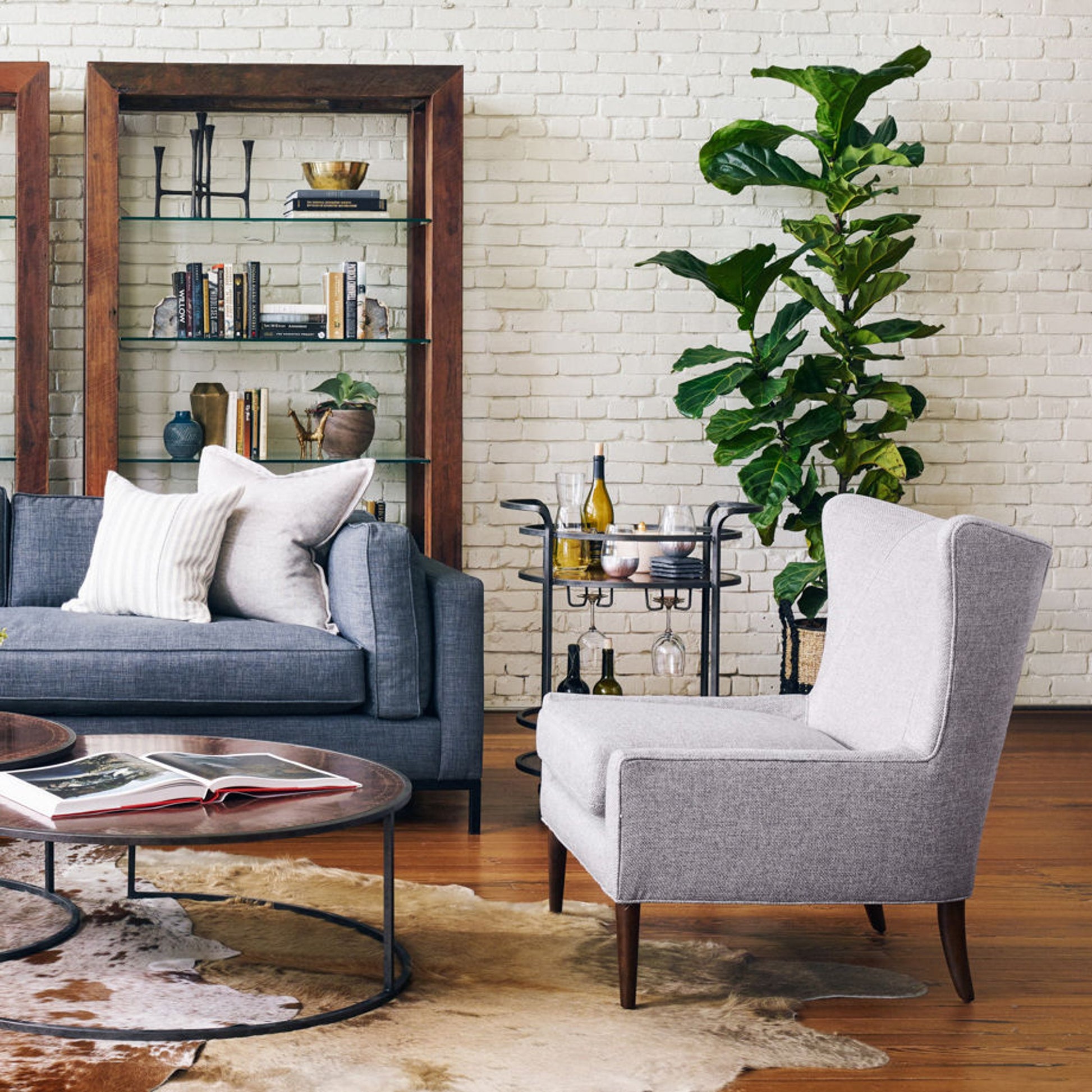 Marlow Wing Chair by Four Hands. Made from top grain leather, solid parawood, 100% polyester in a modern style.