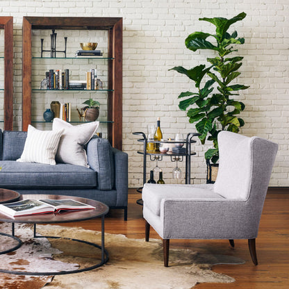 Marlow Wing Chair by Four Hands. Made from top grain leather, solid parawood, 100% polyester in a modern style.