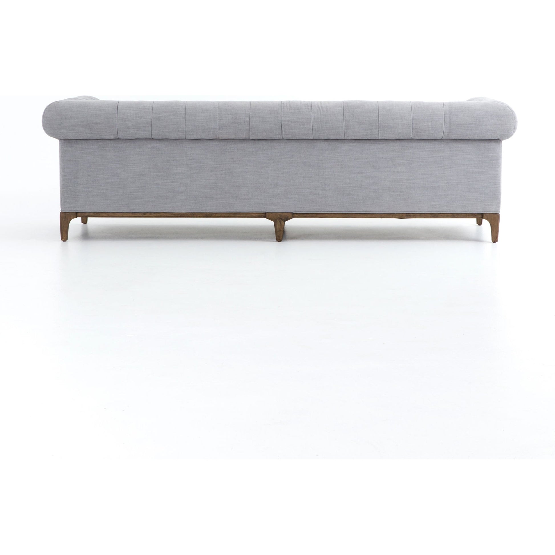Griffon Sofa by Four Hands in plush navy and plush navy, antique walnut. Made from 100% polyester, solid parawood in a modern style.