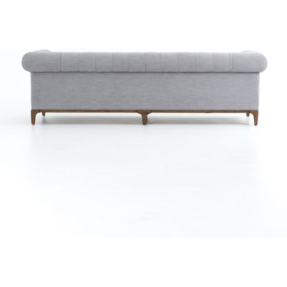 Griffon Sofa by Four Hands in plush navy and plush navy, antique walnut. Made from 100% polyester, solid parawood in a modern style.