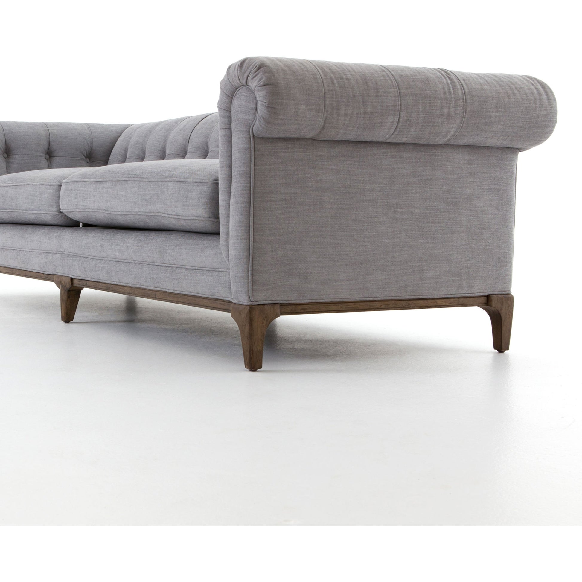 Griffon Sofa by Four Hands in plush navy and plush navy, antique walnut. Made from 100% polyester, solid parawood in a modern style.
