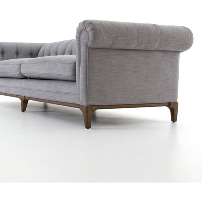Griffon Sofa by Four Hands in plush navy and plush navy, antique walnut. Made from 100% polyester, solid parawood in a modern style.