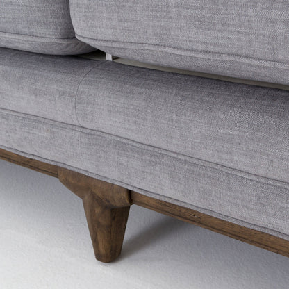 Griffon Sofa by Four Hands in plush navy and plush navy, antique walnut. Made from 100% polyester, solid parawood in a modern style.