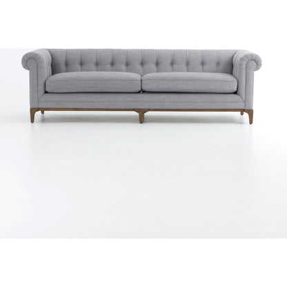 Griffon Sofa by Four Hands in plush navy and plush navy, antique walnut. Made from 100% polyester, solid parawood in a modern style.