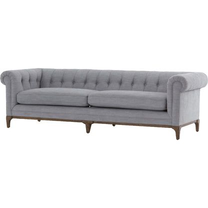 Griffon Sofa by Four Hands in plush navy and plush navy, antique walnut. Made from 100% polyester, solid parawood in a modern style.