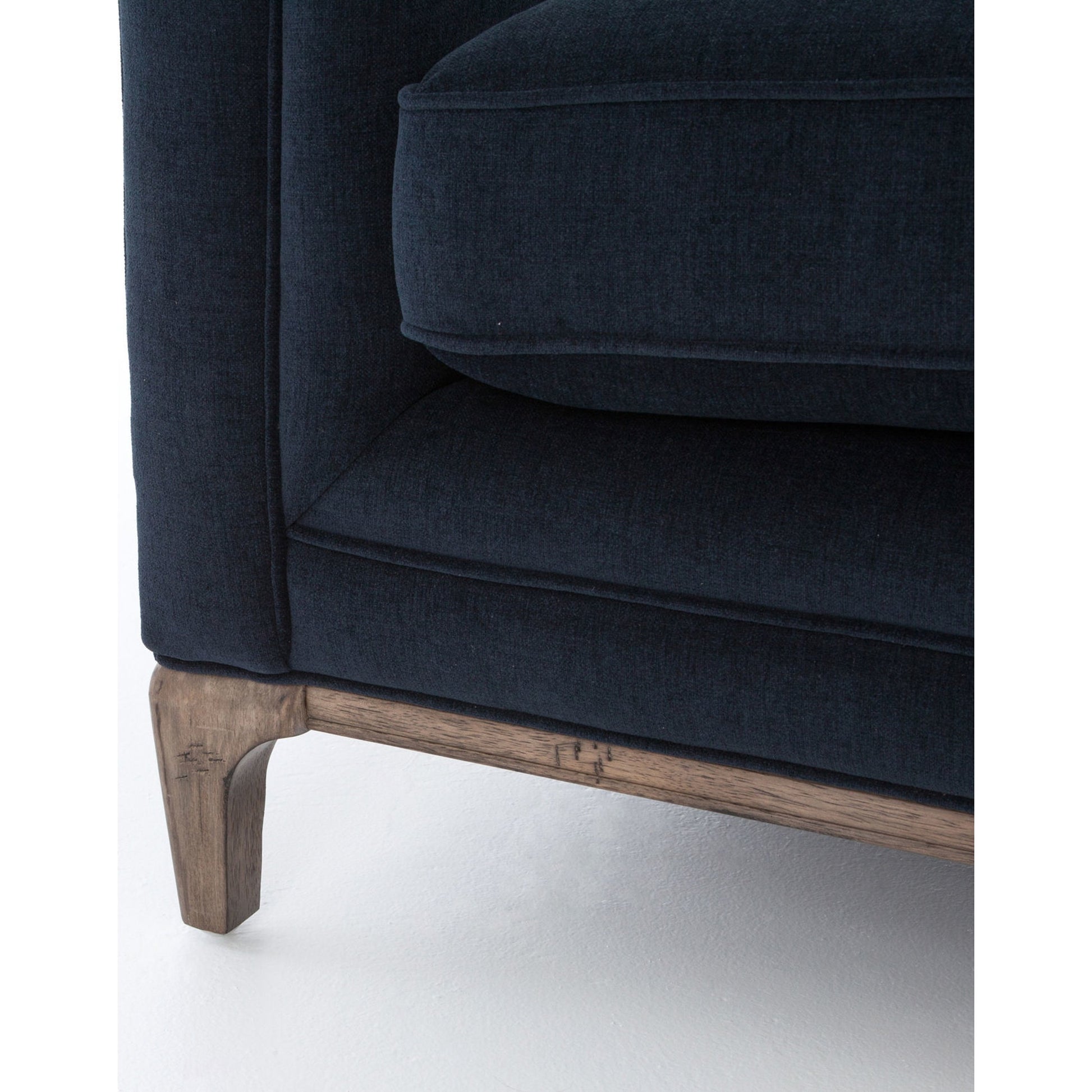 Griffon Sofa by Four Hands in plush navy and plush navy, antique walnut. Made from 100% polyester, solid parawood in a modern style.