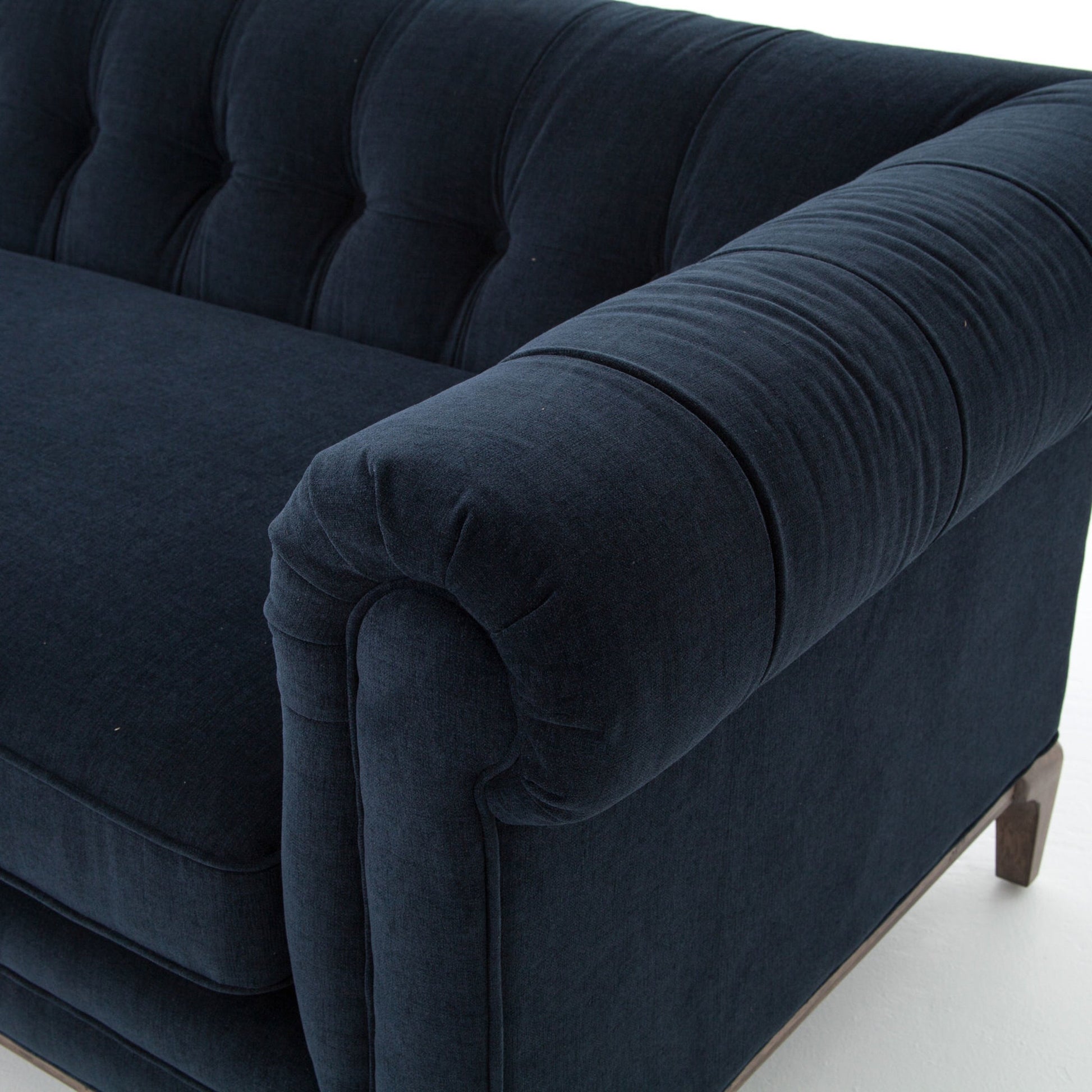 Griffon Sofa by Four Hands in plush navy and plush navy, antique walnut. Made from 100% polyester, solid parawood in a modern style.