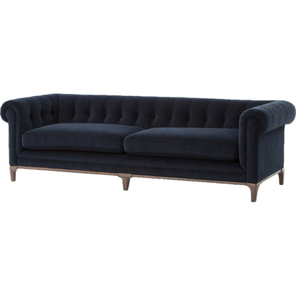 Griffon Sofa by Four Hands in plush navy and plush navy, antique walnut. Made from 100% polyester, solid parawood in a modern style.