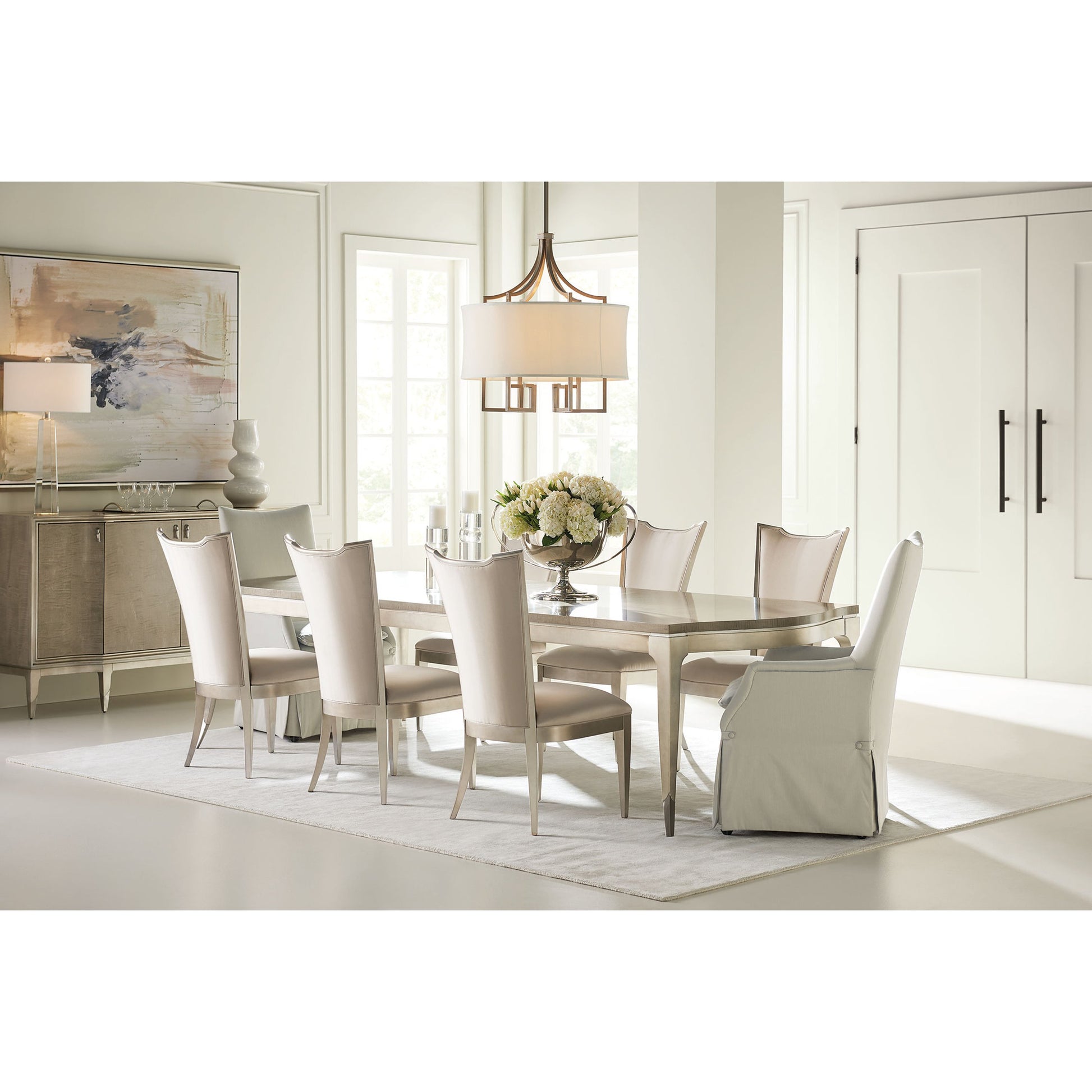 On a Silver Platter Dining Table by Caracole in maple, silver and moonlit sand, soft silver leaf. Made from pine, birch, silver curly maple in a transitional style.