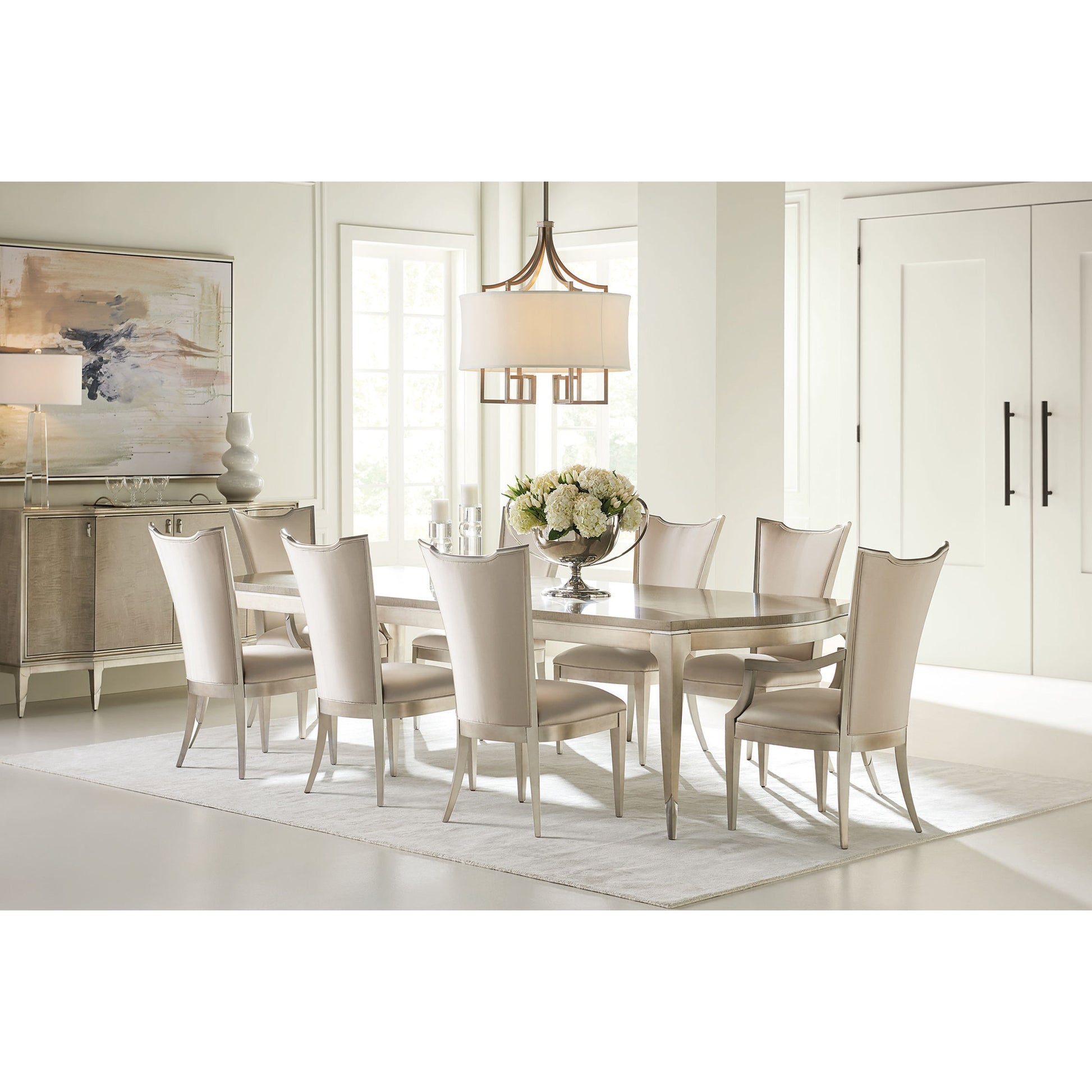 On a Silver Platter Dining Table by Caracole in maple, silver and moonlit sand, soft silver leaf. Made from pine, birch, silver curly maple in a transitional style.