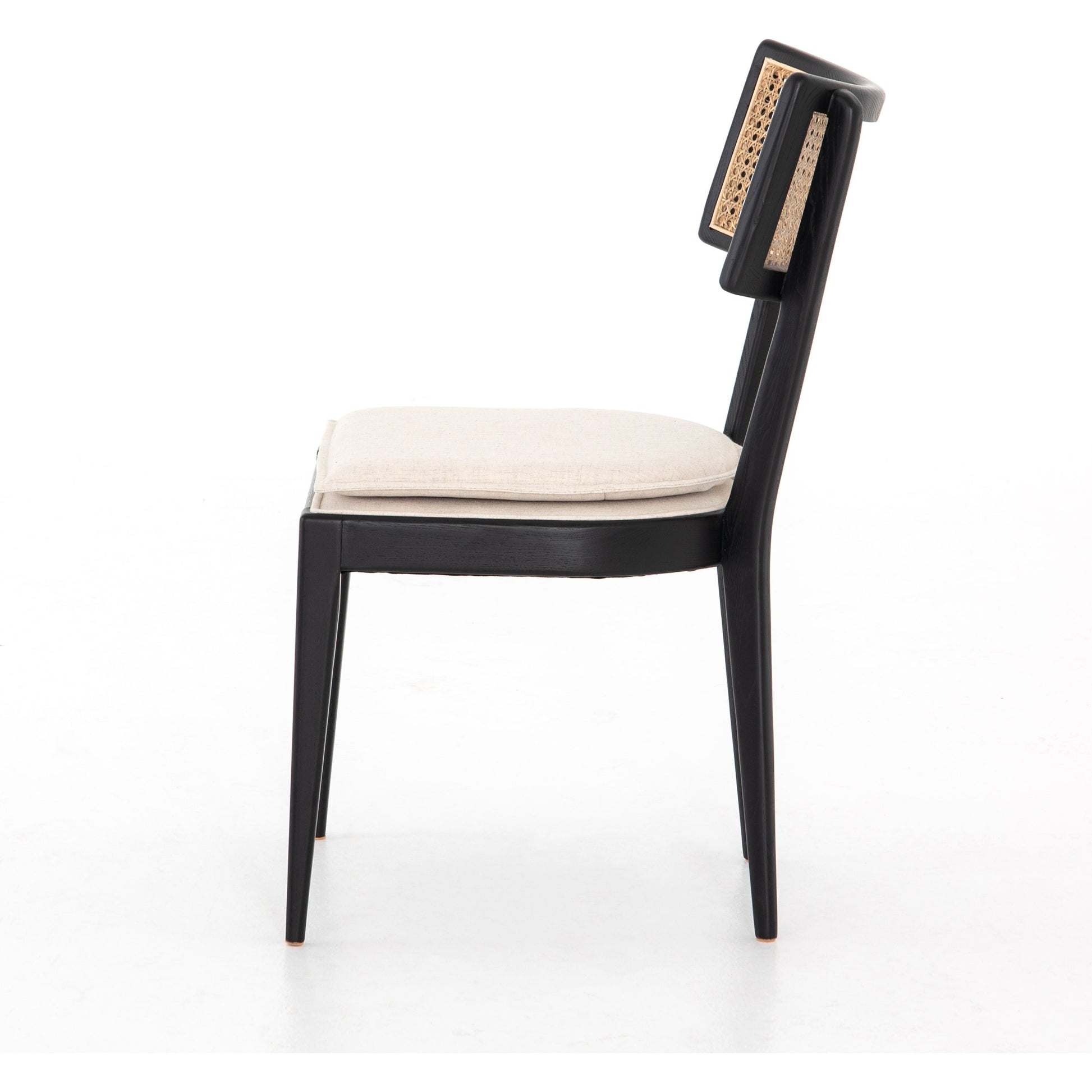 Britt Dining Chair by Four Hands in natural cane, savile flax, brushed ebony. Made from 92% polyester, 8% flax, linen, solid nettlewood, cane in a modern style.