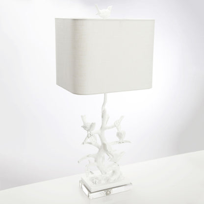Bird on Branch Table Lamp by Couture Lamps in high gloss white. Made from iron, resin, acrylic in a coastal style.
