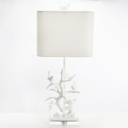 Bird on Branch Table Lamp by Couture Lamps in high gloss white. Made from iron, resin, acrylic in a coastal style.