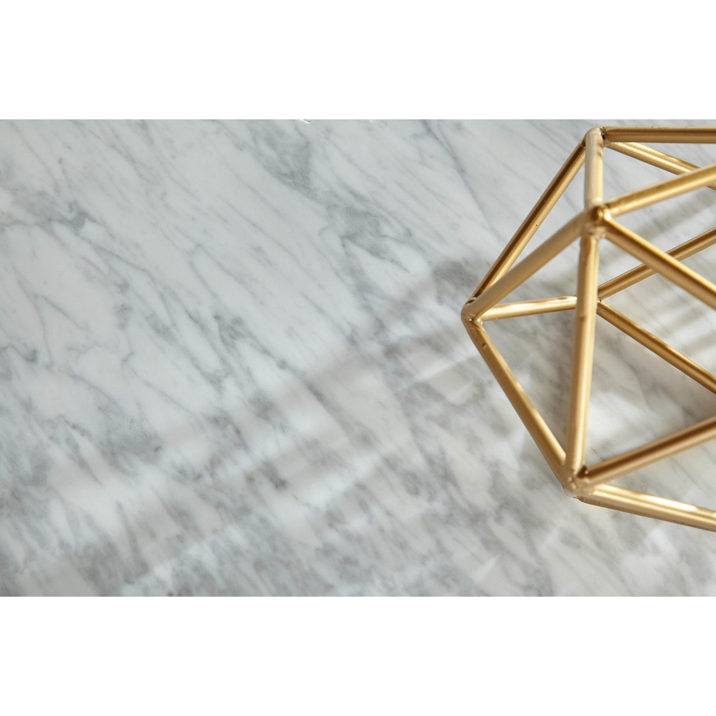 004 SR-387137 | Closeup | Carrera Dining Table by Essentials For Living in white carrera marble, brushed gold. Made from marble veneer over mdf, metal in a modern style.