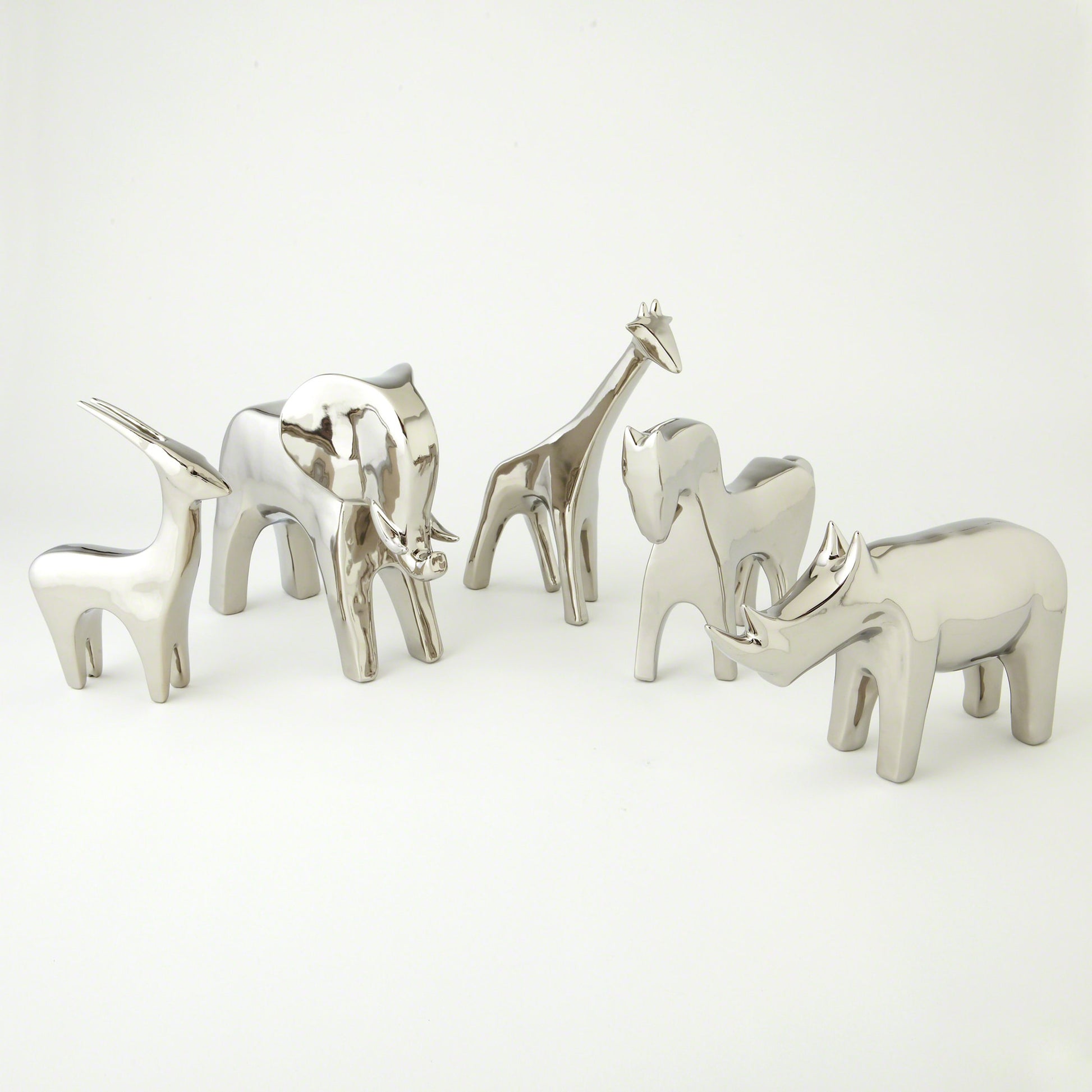 Rhino by Global Views in white. Made from ceramic in a eclectic & global style.