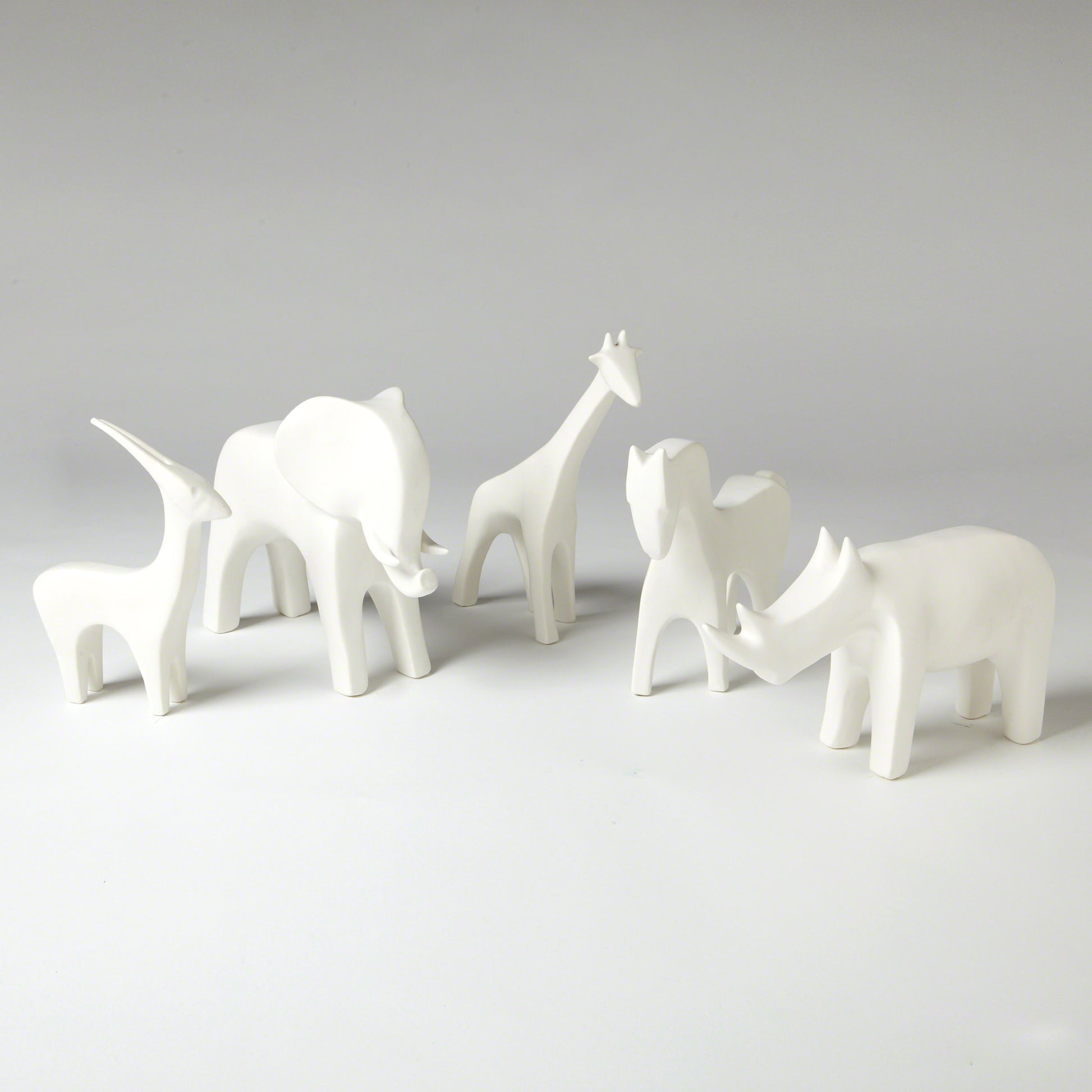 Rhino by Global Views in white. Made from ceramic in a eclectic & global style.