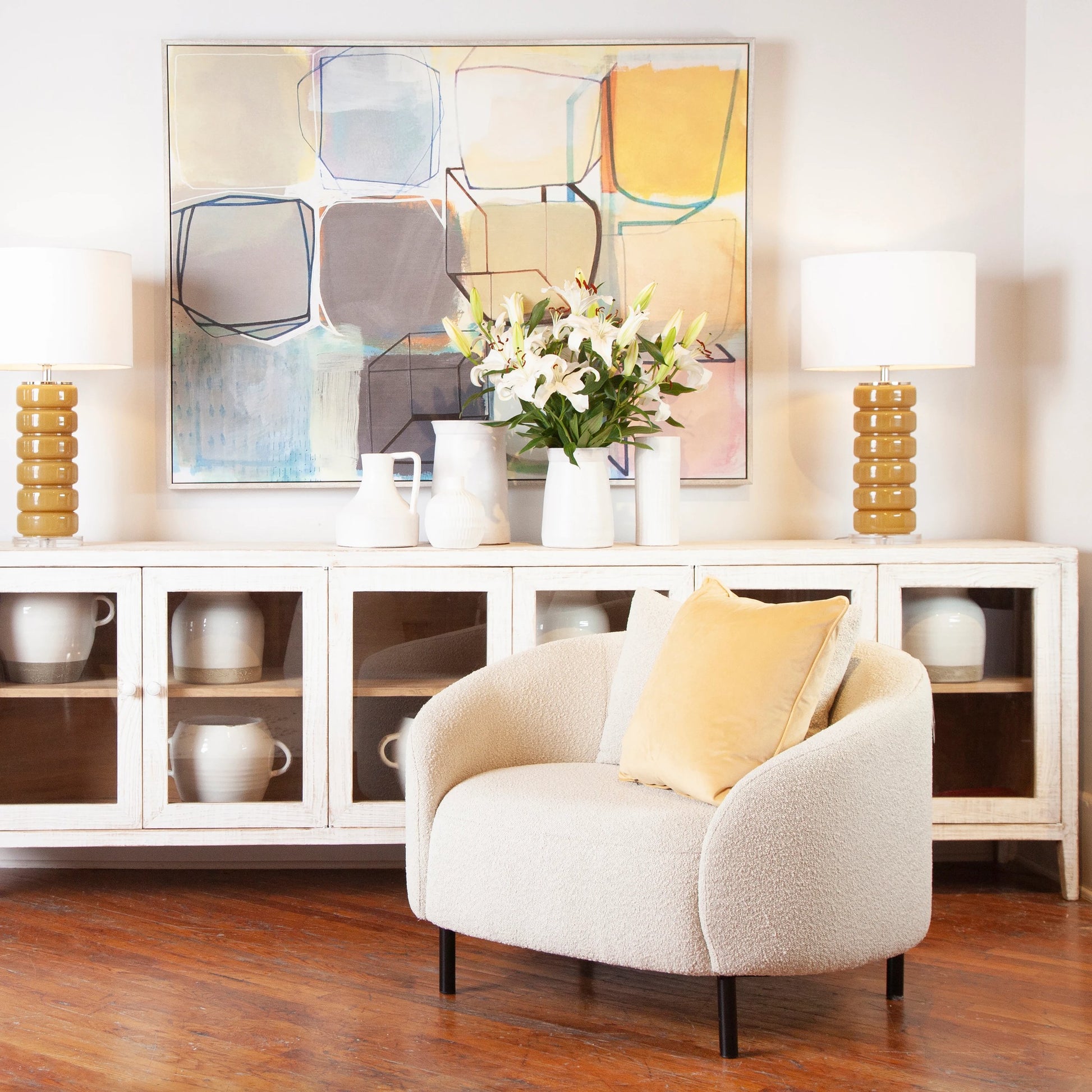 Karolyn White Boucle Barrel Chair with Throw Pillows by Arch & Plane in white, matte black and fabric. Made from boucle in a modern style.