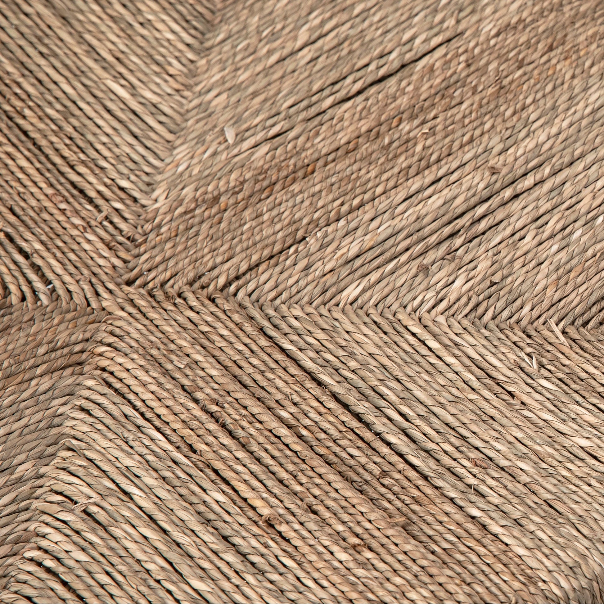 Leanne Oak and Wicker Wishbone Back Dining Arm Chair by Arch & Plane in medium brown and woven. Made from oak in a cottage & farmhouse style.