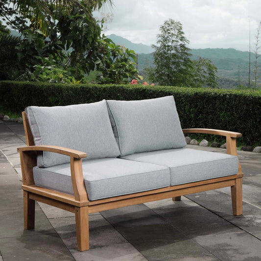 Andover Teak Loveseat by Evans & Londeen. Made from teak wood, cushion density is 24kg, m3 in a modern style.