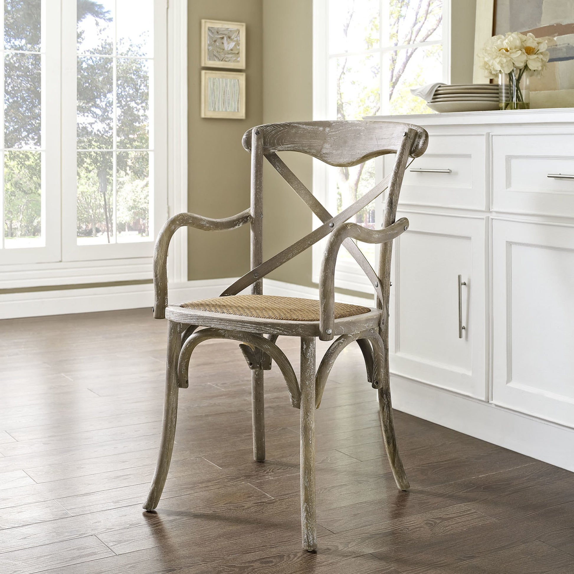 Easton Dining Armchair by Evans & Londeen in walnut. Made from chinese toon, plywood, rattan in a cottage & farmhouse style.