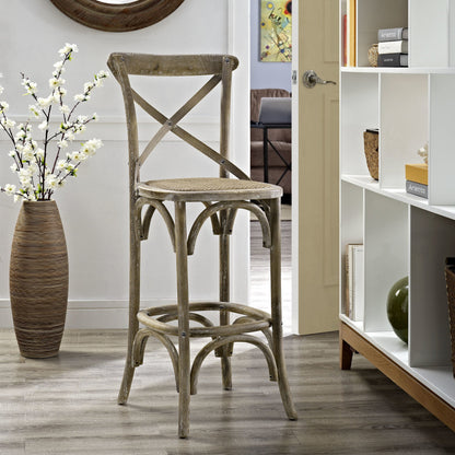 Easton Bar Stool by Evans & Londeen. Made from edge chinese elm wood, middle p2 plywood, top rattan, white foot pins in a cottage & farmhouse style.
