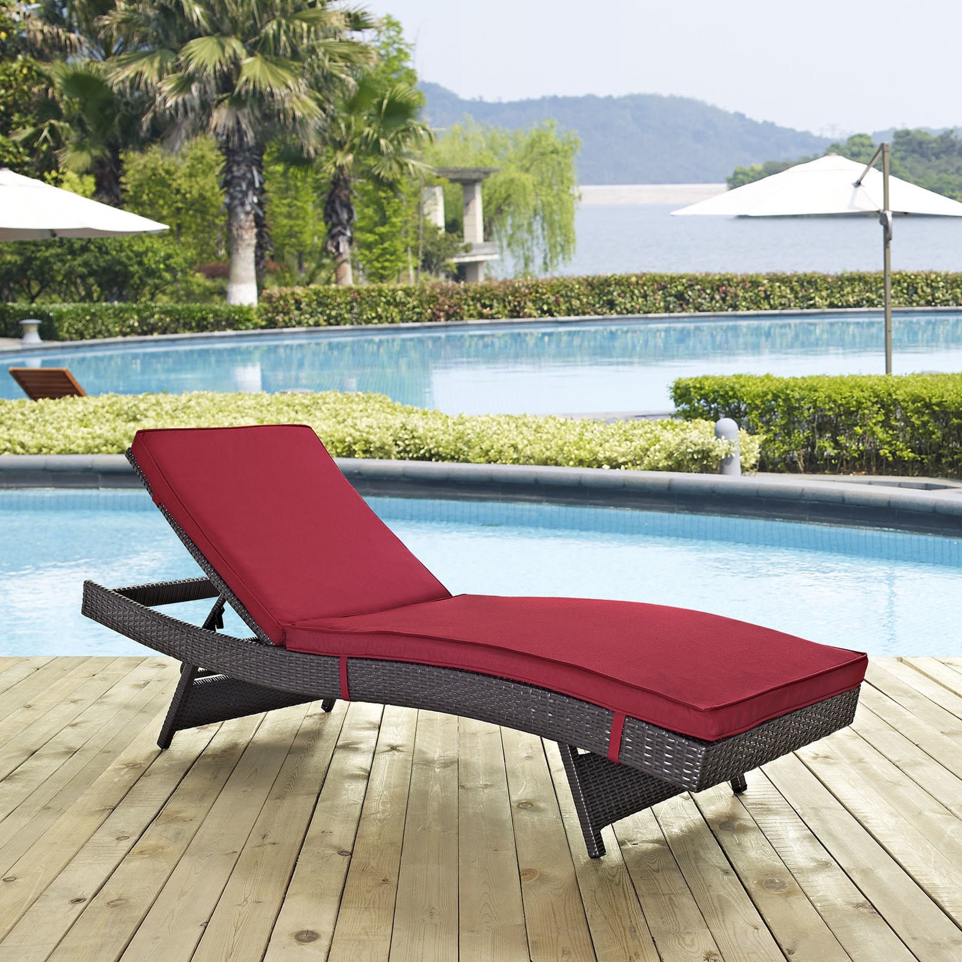 Amelia Outdoor Patio Chaise by Evans & Londeen. Made from synthetic rattan weave, powder coated aluminum, cushion density is 24kg, m3 in a modern style.