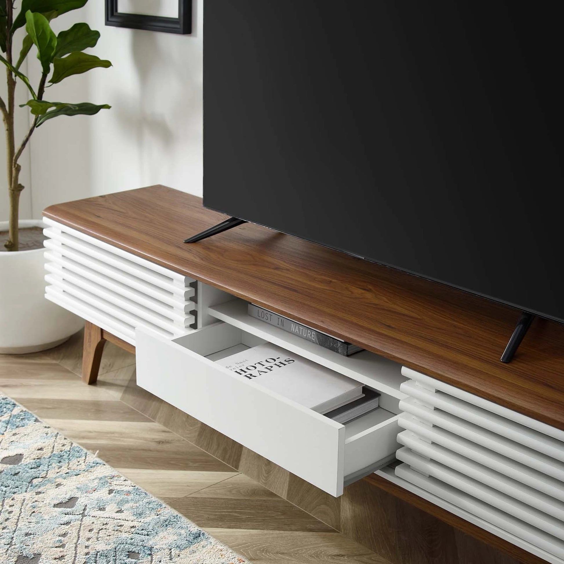 Rennell 70" TV Stand by Evans & Londeen. Made from particle board, mdf in a modern style.
