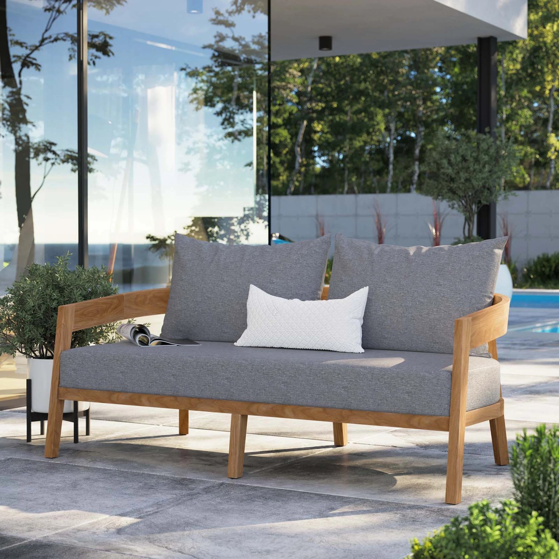 Hazelton Teak Wood Loveseat by Evans & Londeen. Made from teak wood, polyester, mesh sling, plastic tack glides, stainless steel in a modern style.