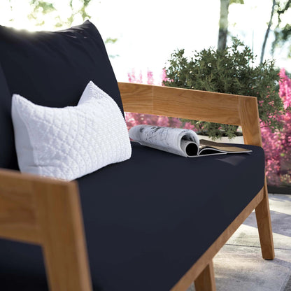 Hazelton Teak Wood Loveseat by Evans & Londeen. Made from teak wood, polyester, mesh sling, plastic tack glides, stainless steel in a modern style.